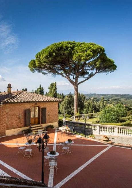 central courtyard with garden tables and chairs, Tuscany