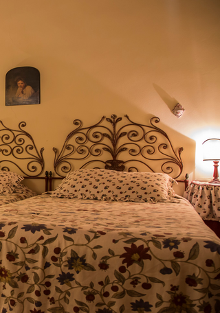 details of the bedroom in a Tuscan apartment