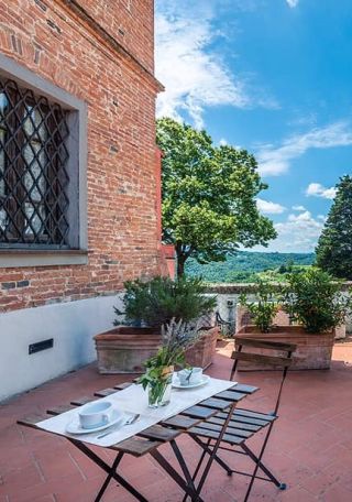 Garden table on the terrace of a Tuscan apartment