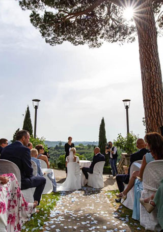 Symbolic ceremony in a garden in front of a Tuscan Villa 